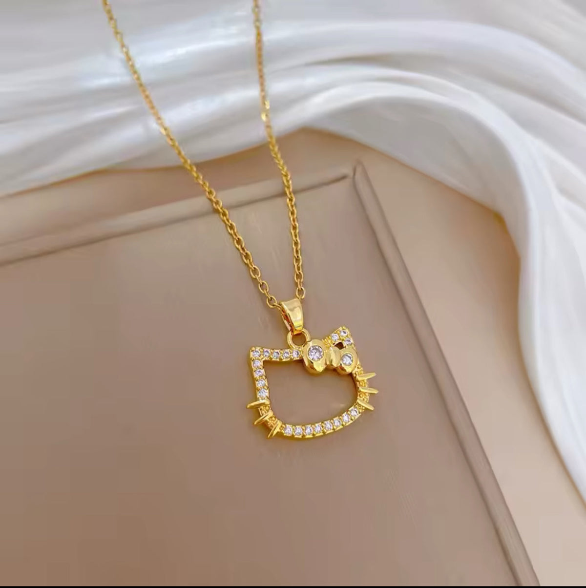 Gold HK necklace.